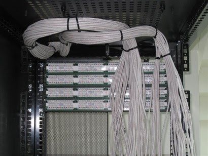 Cable bundle dressing: Horizontal cable bundles dressed and service loops secured at the rack.